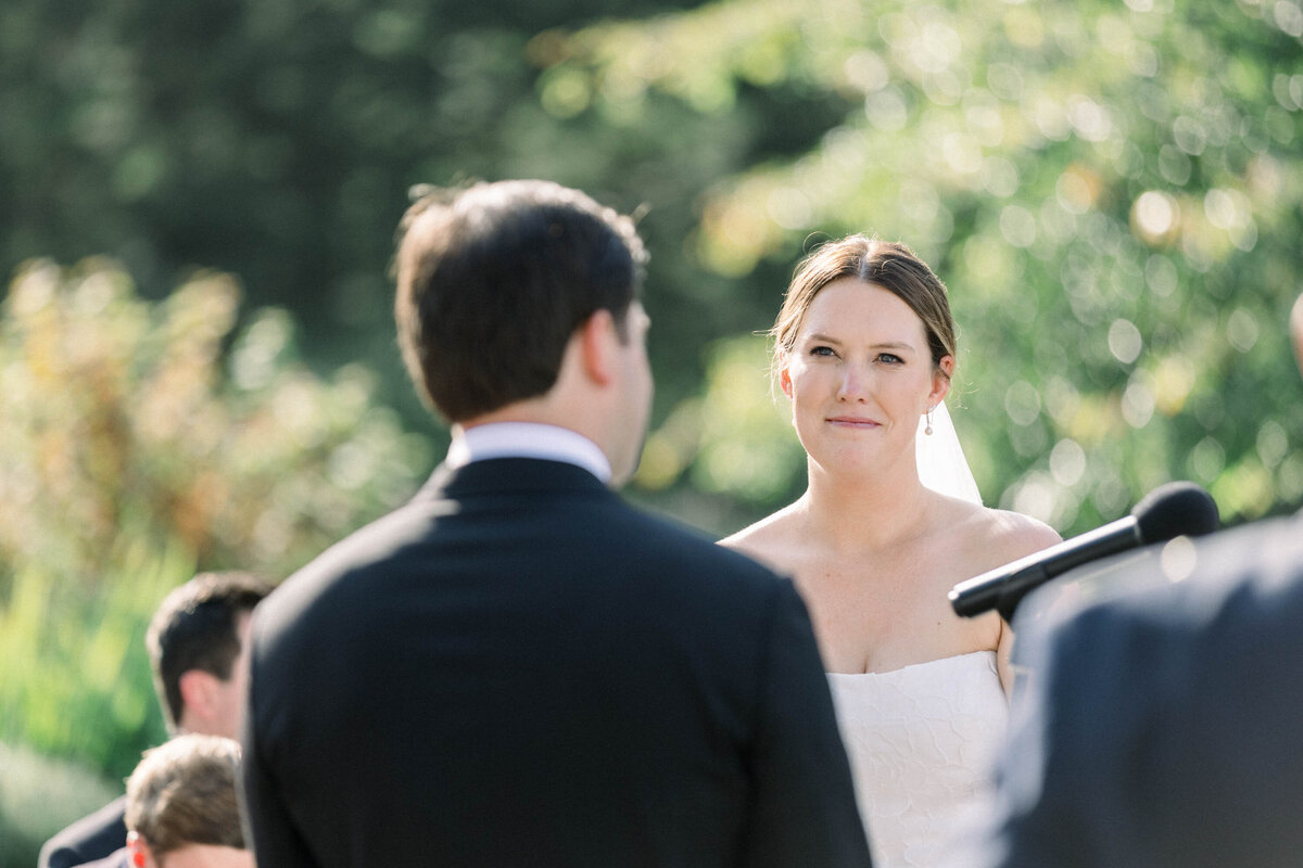 close up of brides face at ceremony
