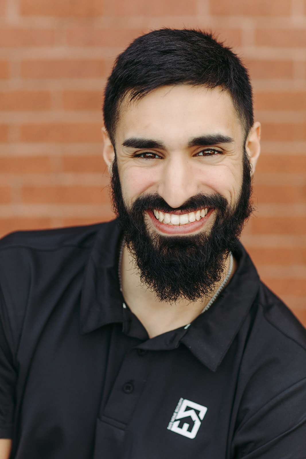 Utah Family Photographer captures man in black shirt smiling with a beard