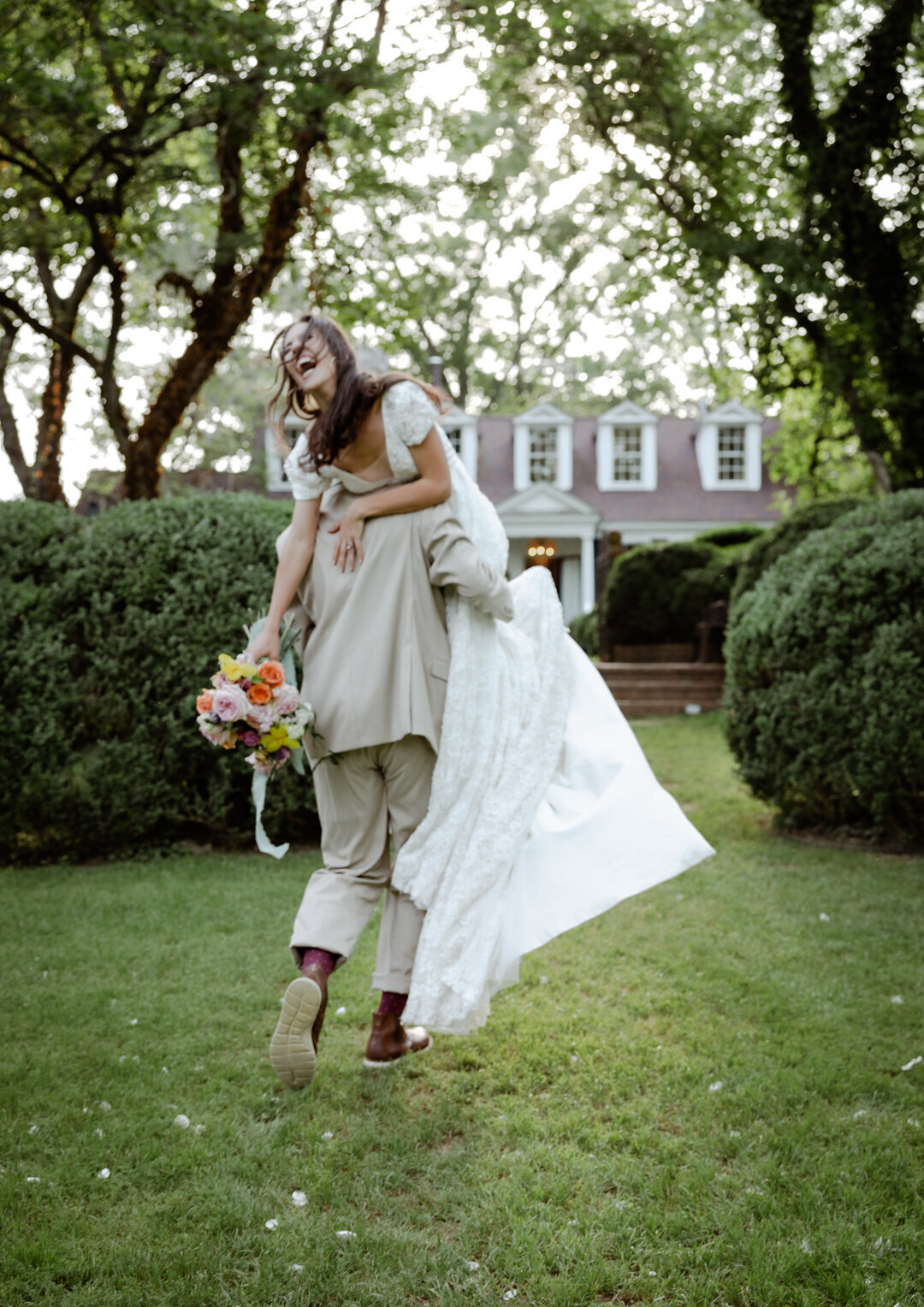 Bride and groom together in a lush green garden during their spring elopement in Atlanta.