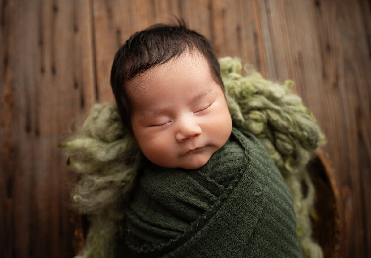 fort worth baby boy wrapped in green