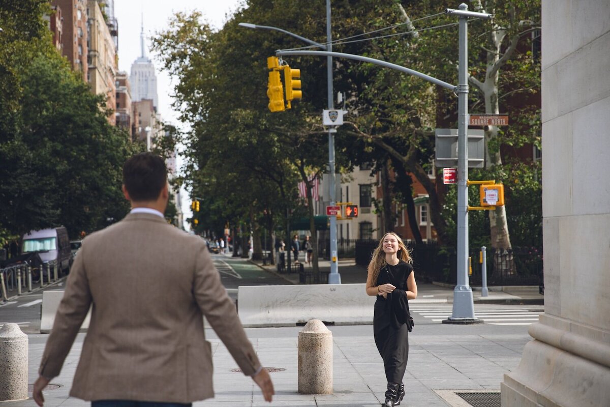 Bride-to-be walking toward proposal spot with excitement.
