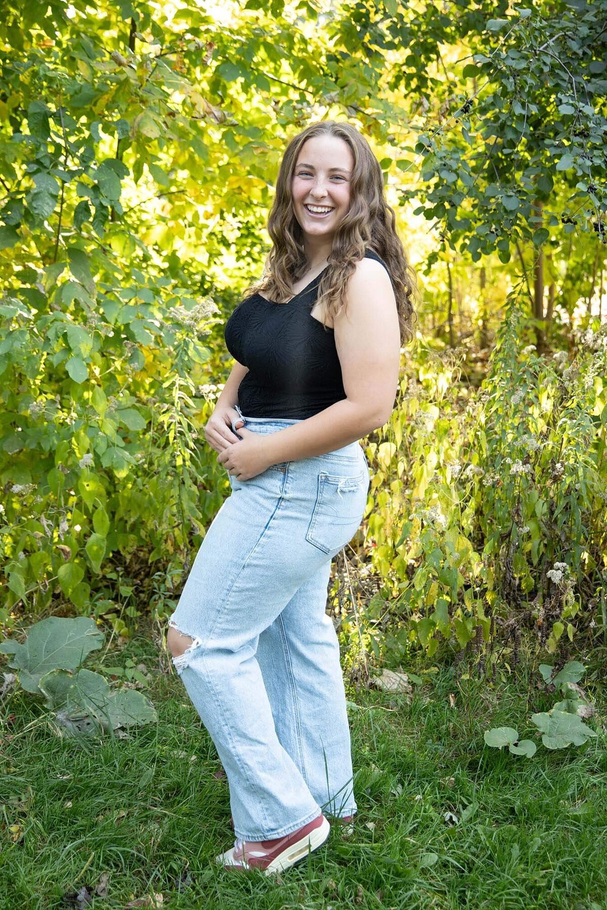 senior-girl-laughing-outdoors-in-park