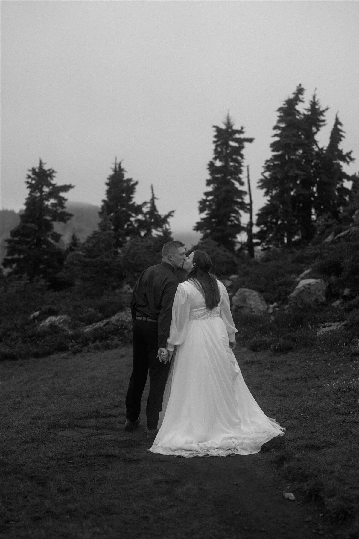 Black & white photo of bride & groom kissing after their elopement ceremony near Mount Baker!