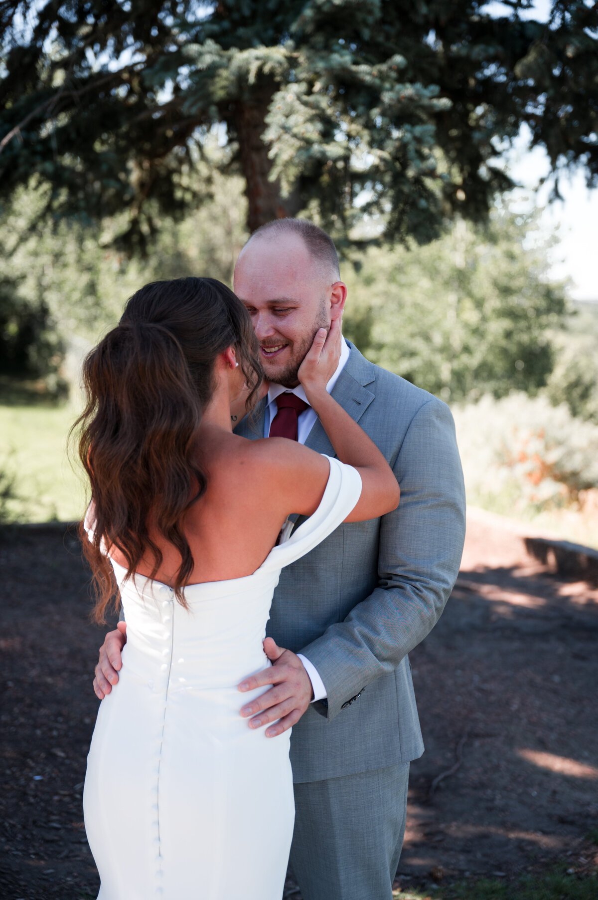 bride grabs the groom to kiss him