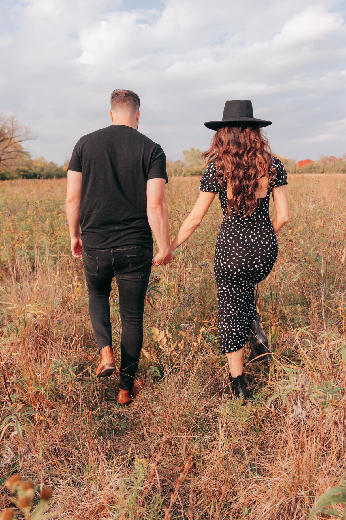 couple-holding-handss-and-walkling-away