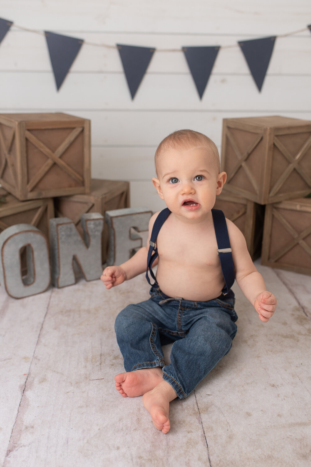 Little boy looking at camera a first birthday cake smash session in Canton, Connecticut |Sharon Leger Photography | Canton, CT Newborn & Family Photographer