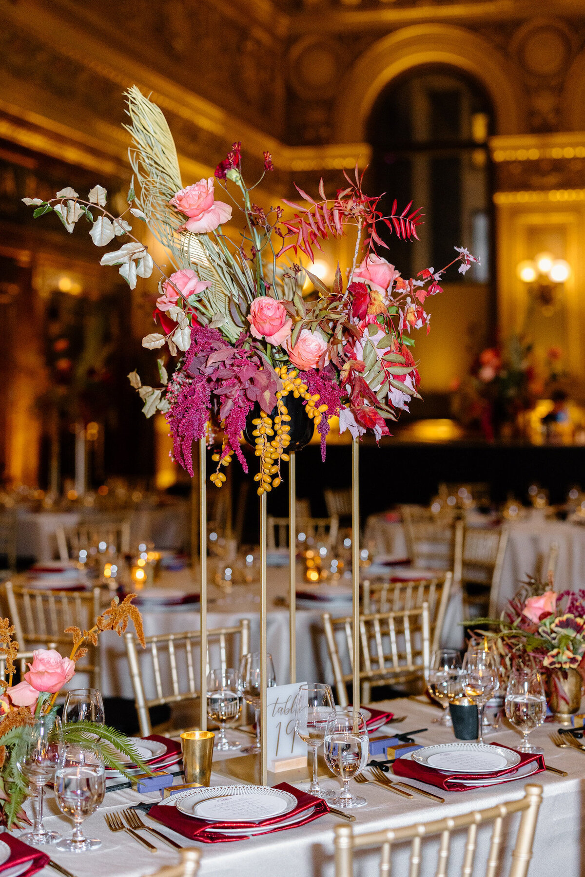 Colorful, eclectic tablescape with rental table numbers