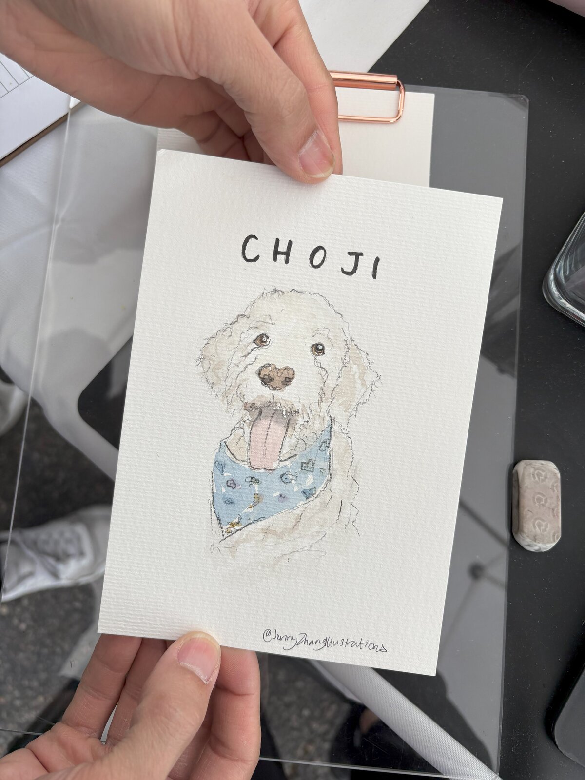 Event painter creating hand-drawn dog portraits as part of luxury and pet-focused event entertainment