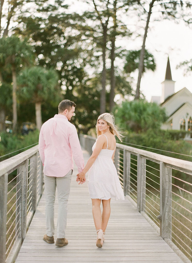 Couple on Dock Holding Hands at May River Chapel Photo