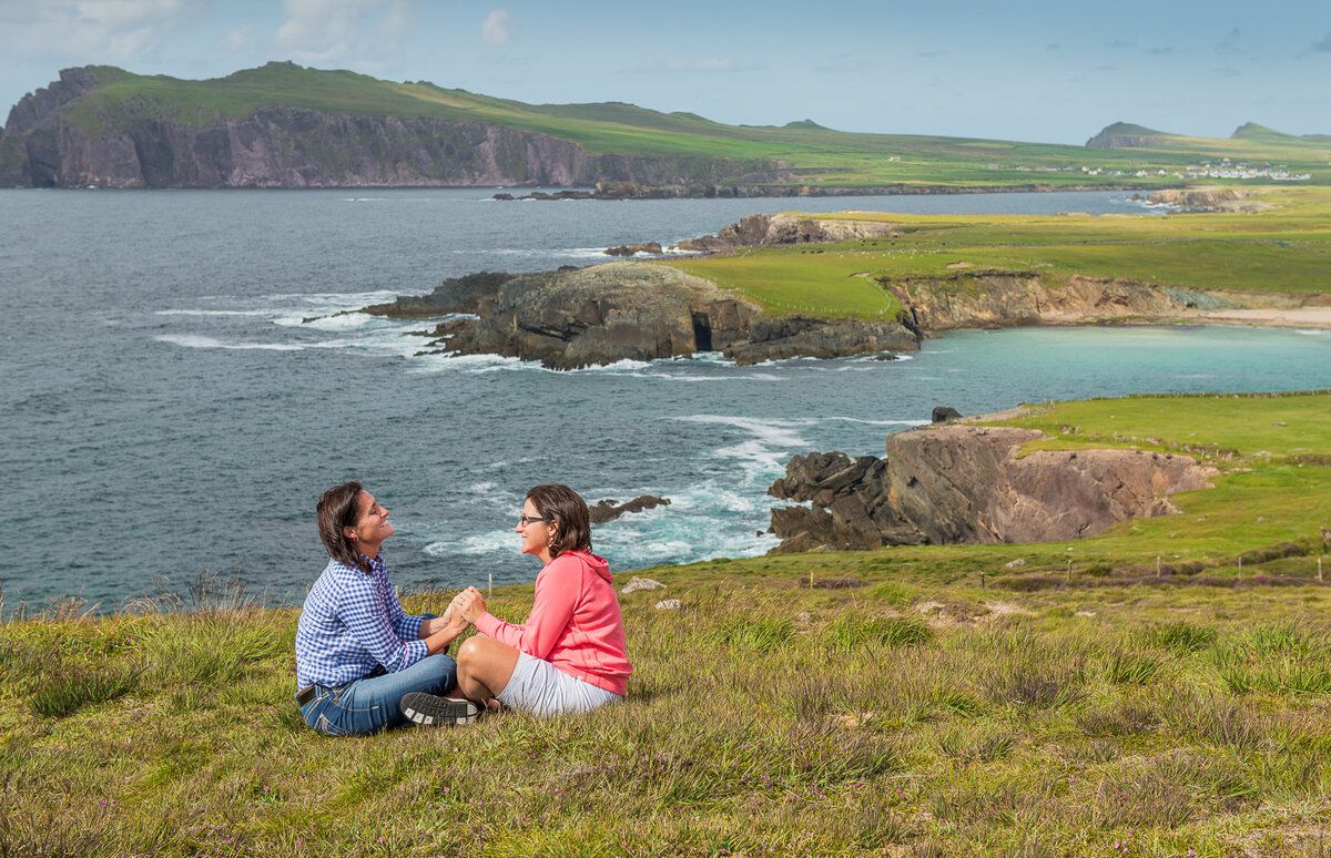 gay female couple proposing on a cliff in Kerry