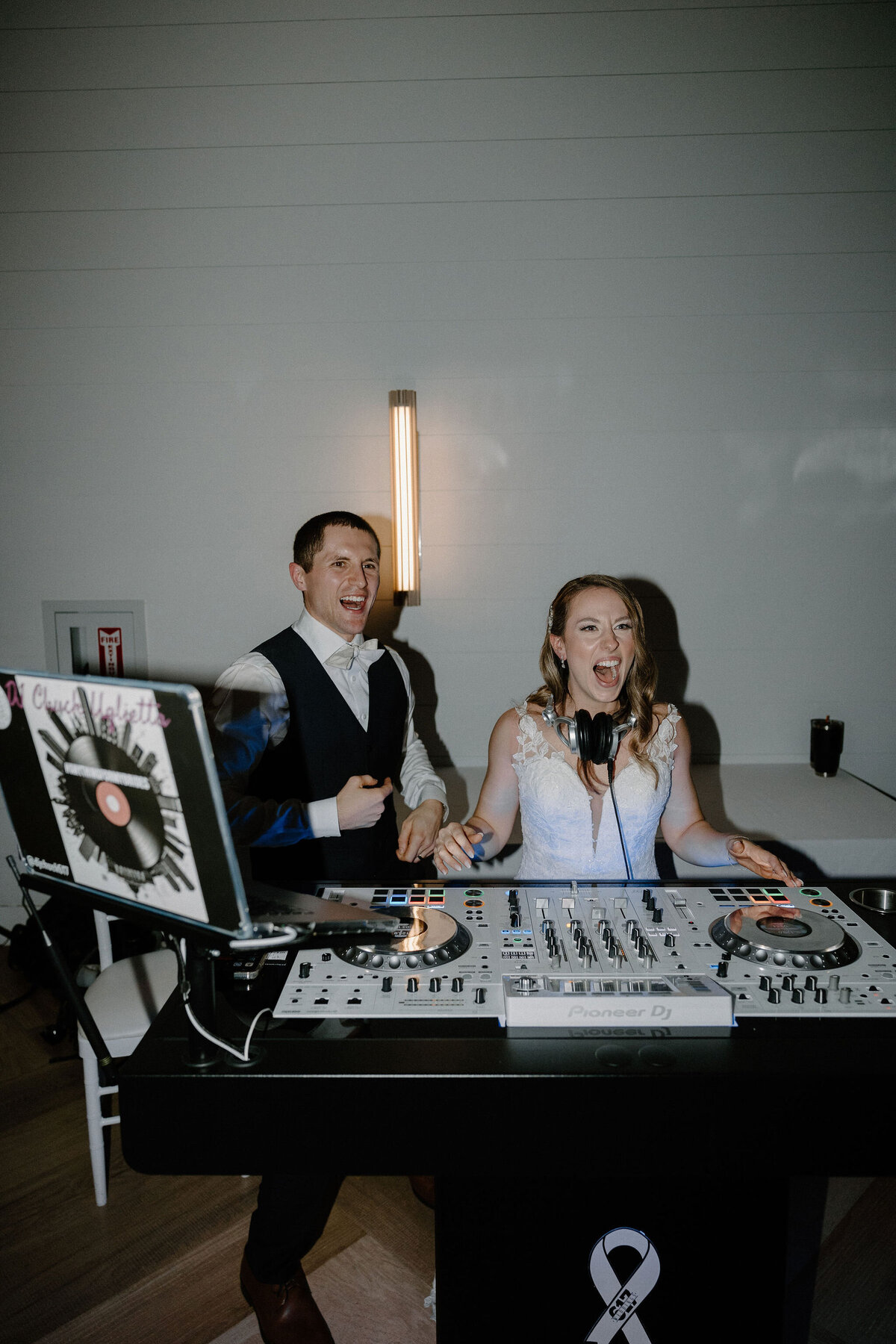 bride and groom at DJ booth