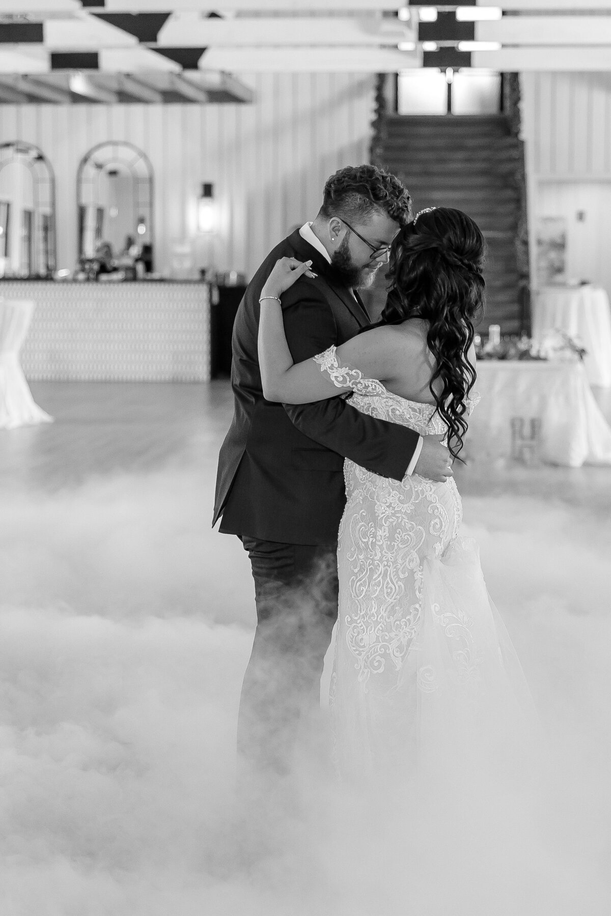 black and white of bride and groom first dance in clouds at Texas wedding New Braunfels