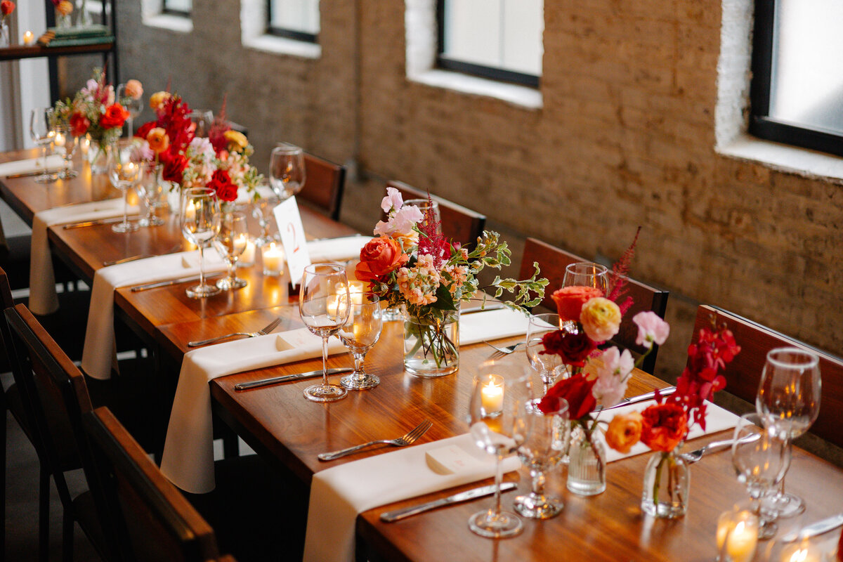 wood table bud vases and candles