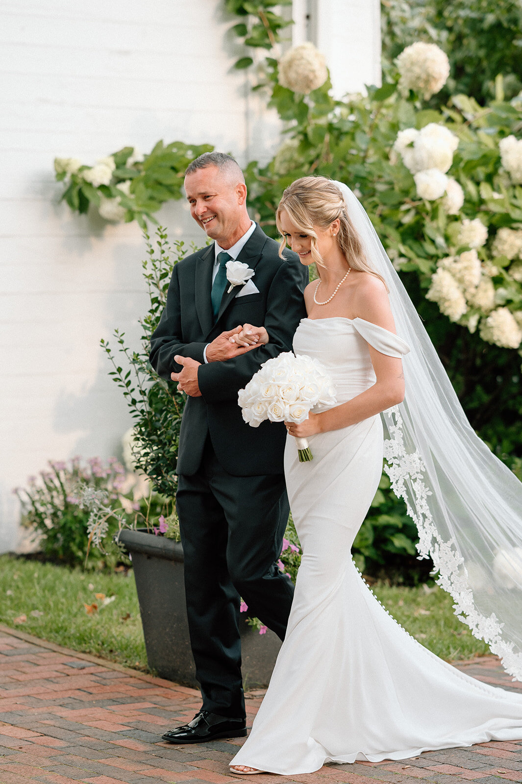 Topsfield, MA wedding photographer captures a documentary moment walking down the aisle at the commons 1854 venue (arianna lyn photography, Boston wedding photographer)