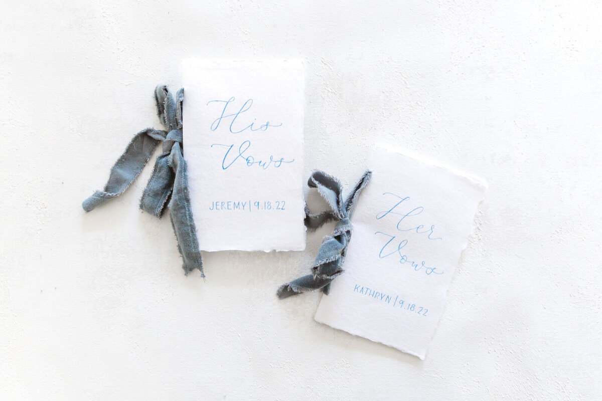 Vow books with blue ribbon