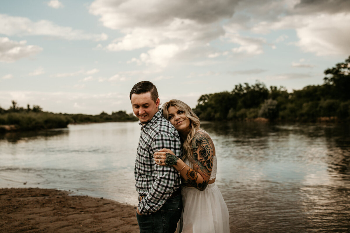 eloping couple standing by the Rio Grande river