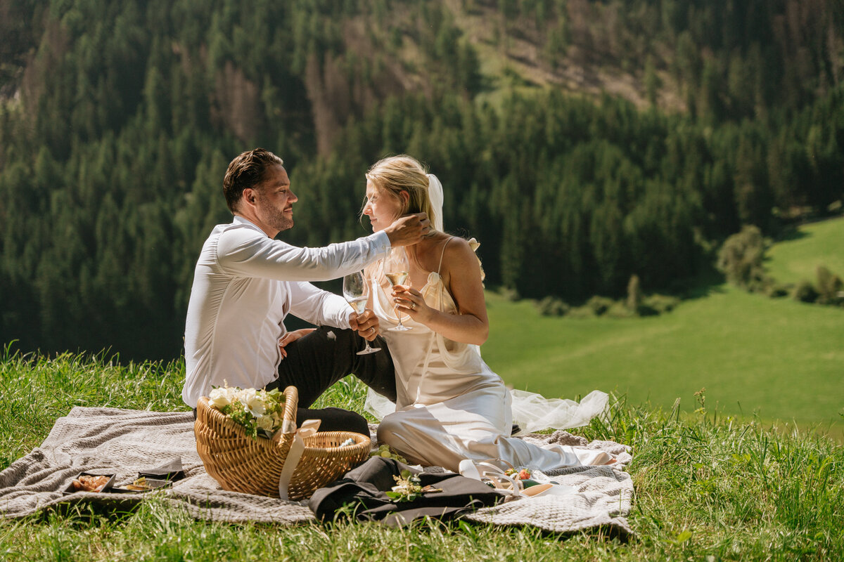 Scenic view of Dolomites peaks behind bride and groom