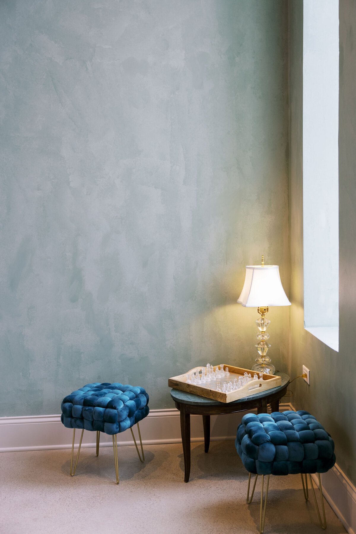 an immediately soothing space featuring a quiet nook for privacy and relaxation, hand painted sage green walls