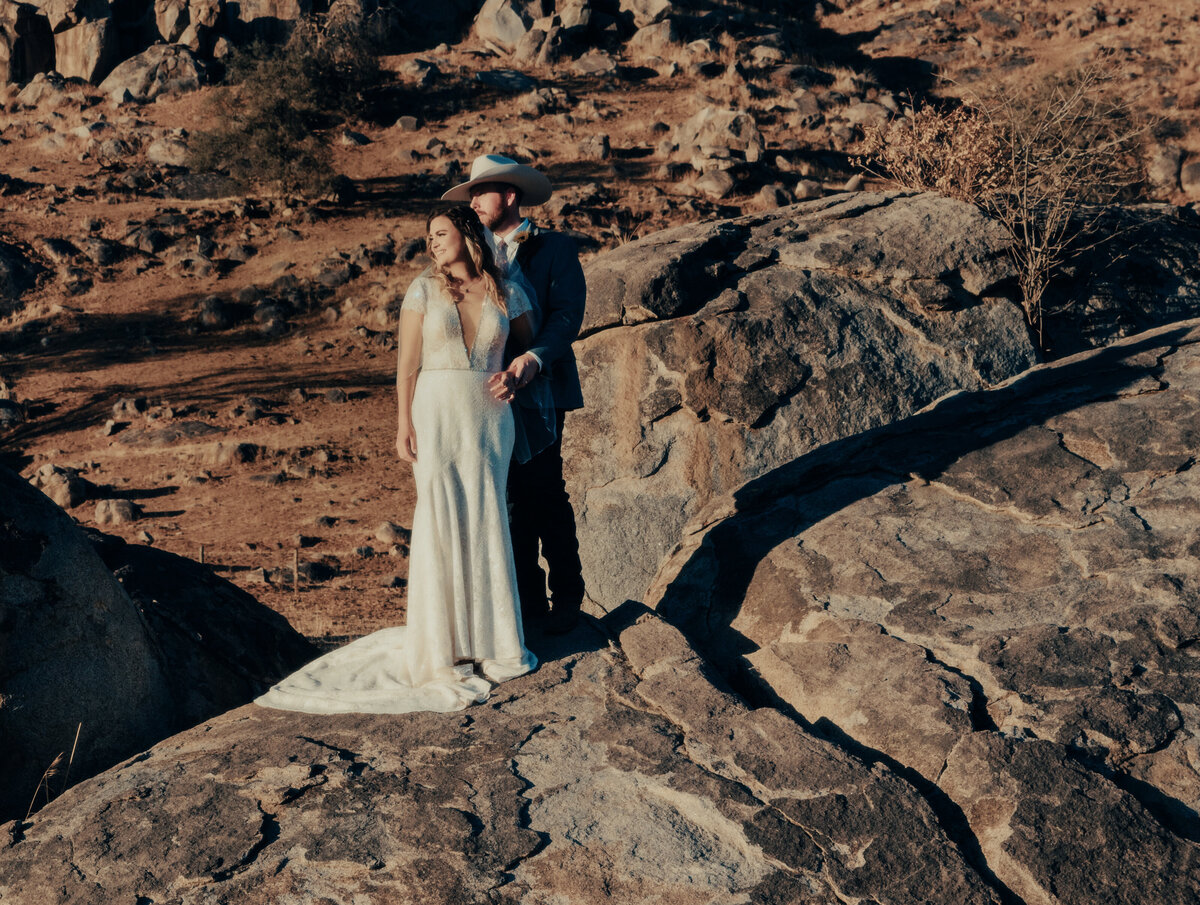Bride and groom walking down path