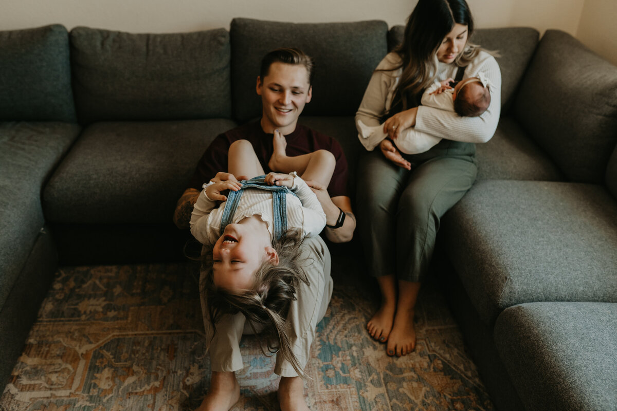 arizona family enjoying new baby in living room