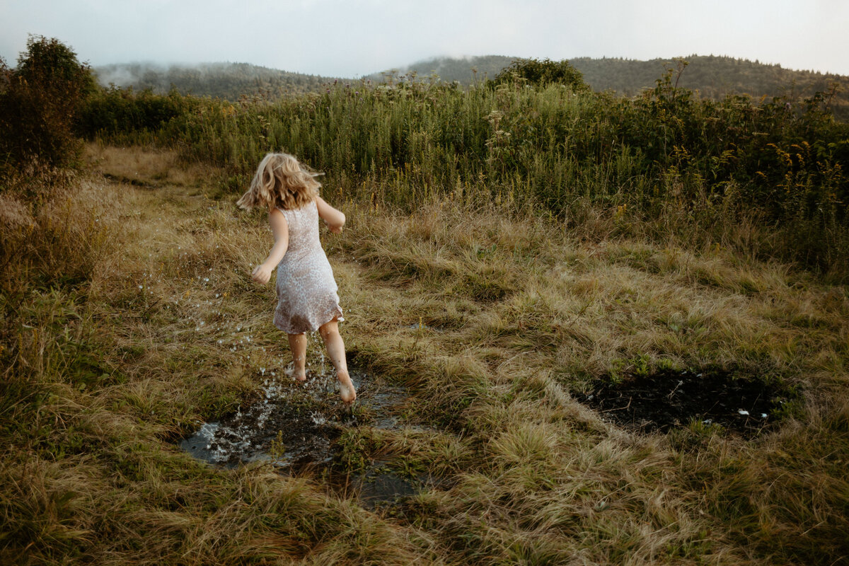 daughter splashing in puddle