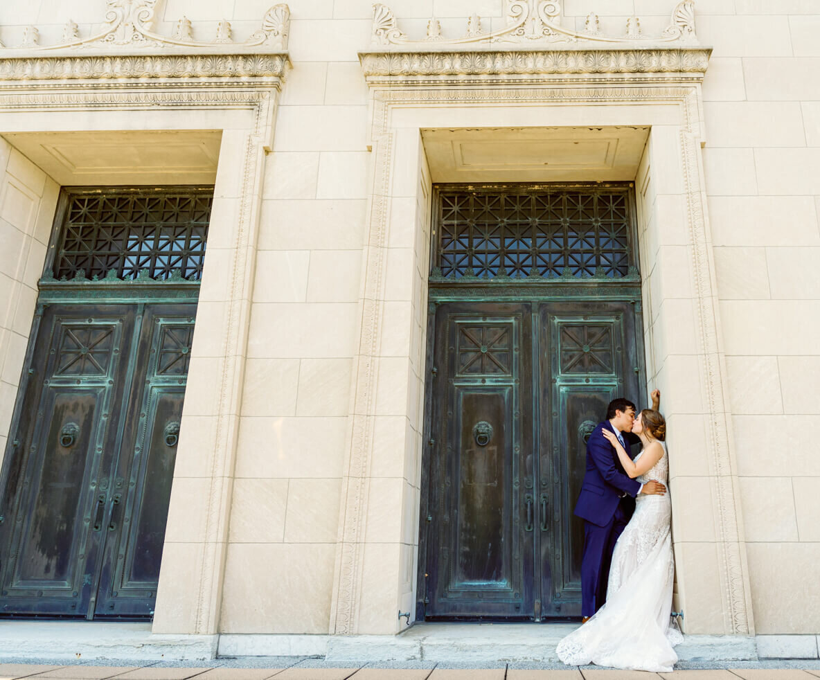 Bride and Groom sharing a moment in the doorway of the Dayton Masonic Temple during the wedding day.