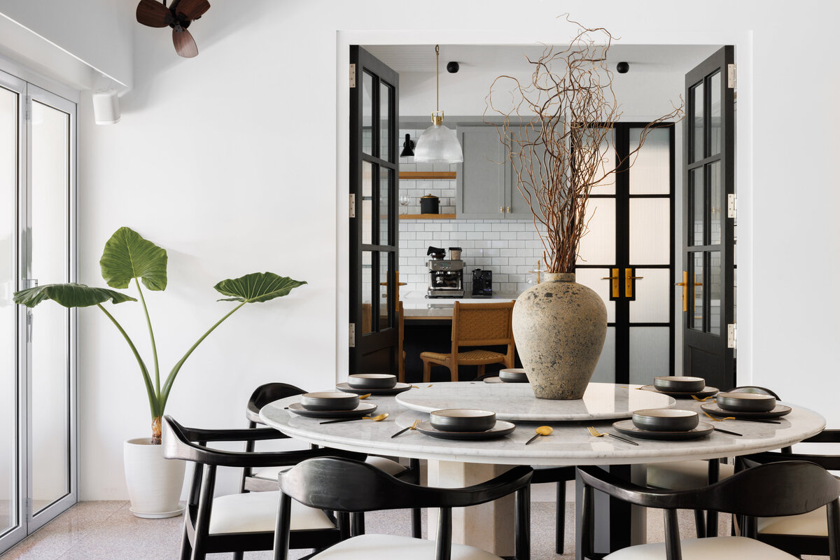 circular dining  table with doors in background