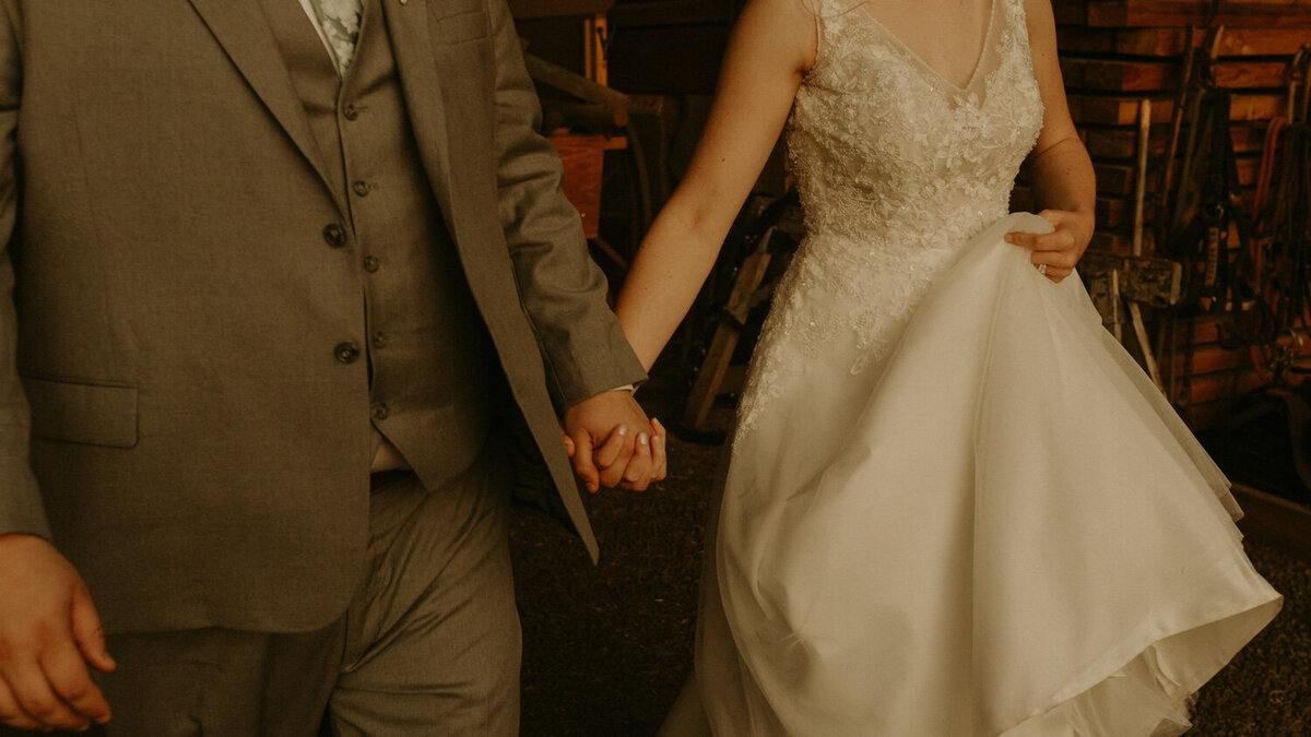 Married couple holding each other's hand while walking