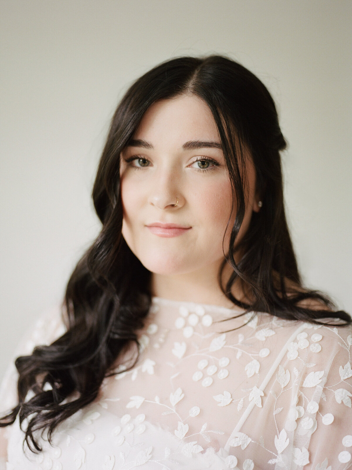 portrait of bride with hazel eyes, dark hair, bridal cape, by Michigan film wedding photographer Christina Harrison