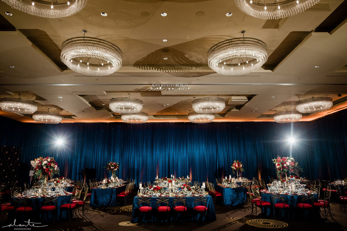 the Four Seasons Seattle ballroom draped in navy blue and red chairs