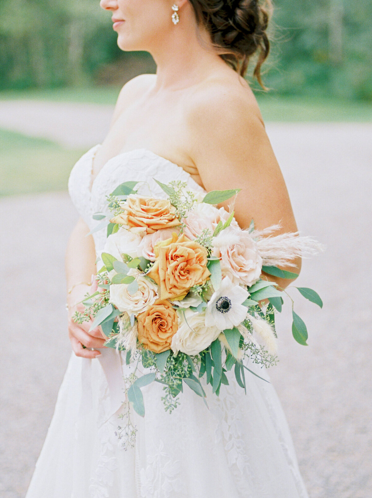 Bright and romantic orange, pink and white bouquet by Lovella Lifestyle, whimsical and romantic Edmonton wedding florist, featured on the Brontë Bride Vendor Guide.