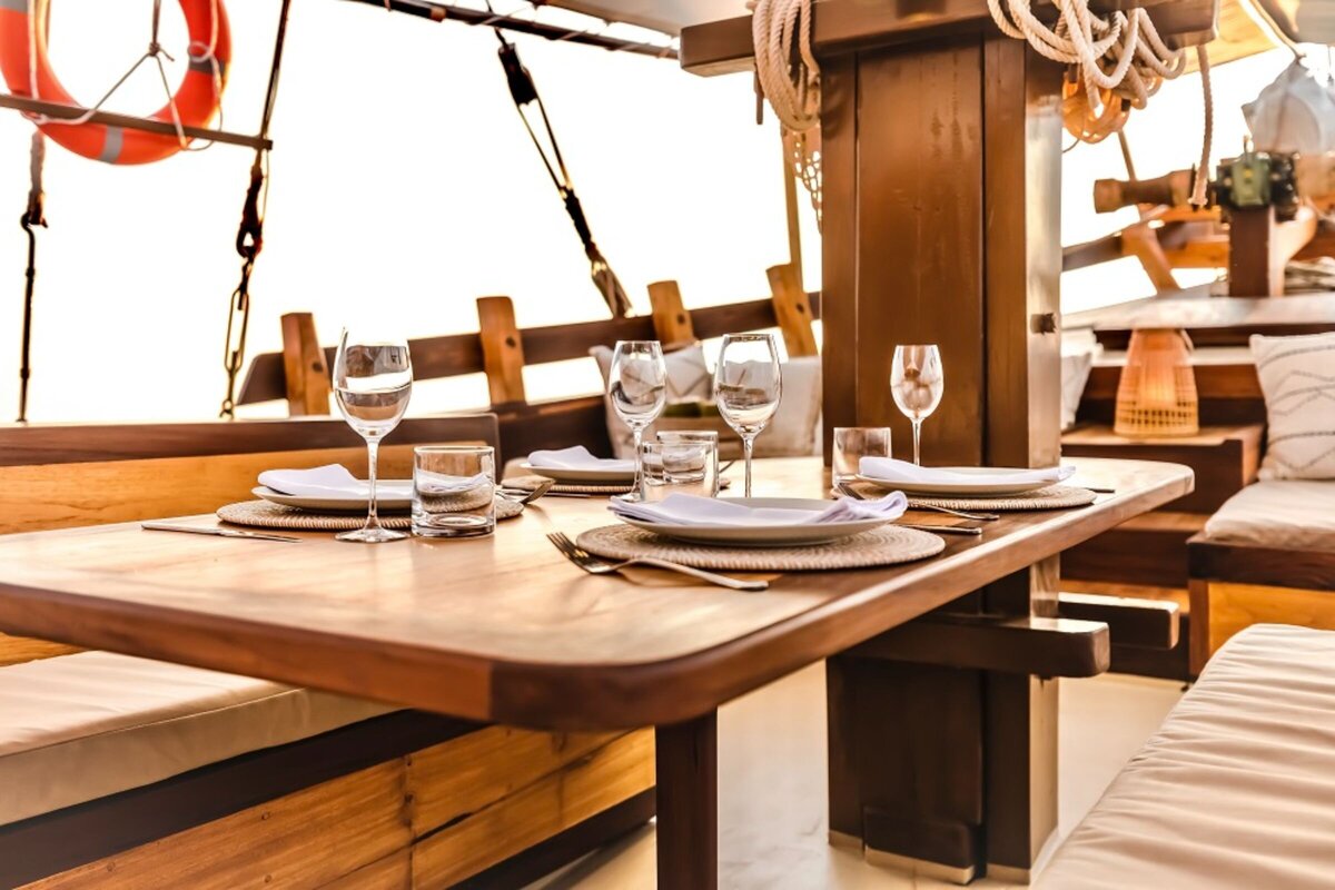 Senja Luxury Yacht Charter Indonesia _lowdef_dining _ chill area_dining_sunset_landscape 2