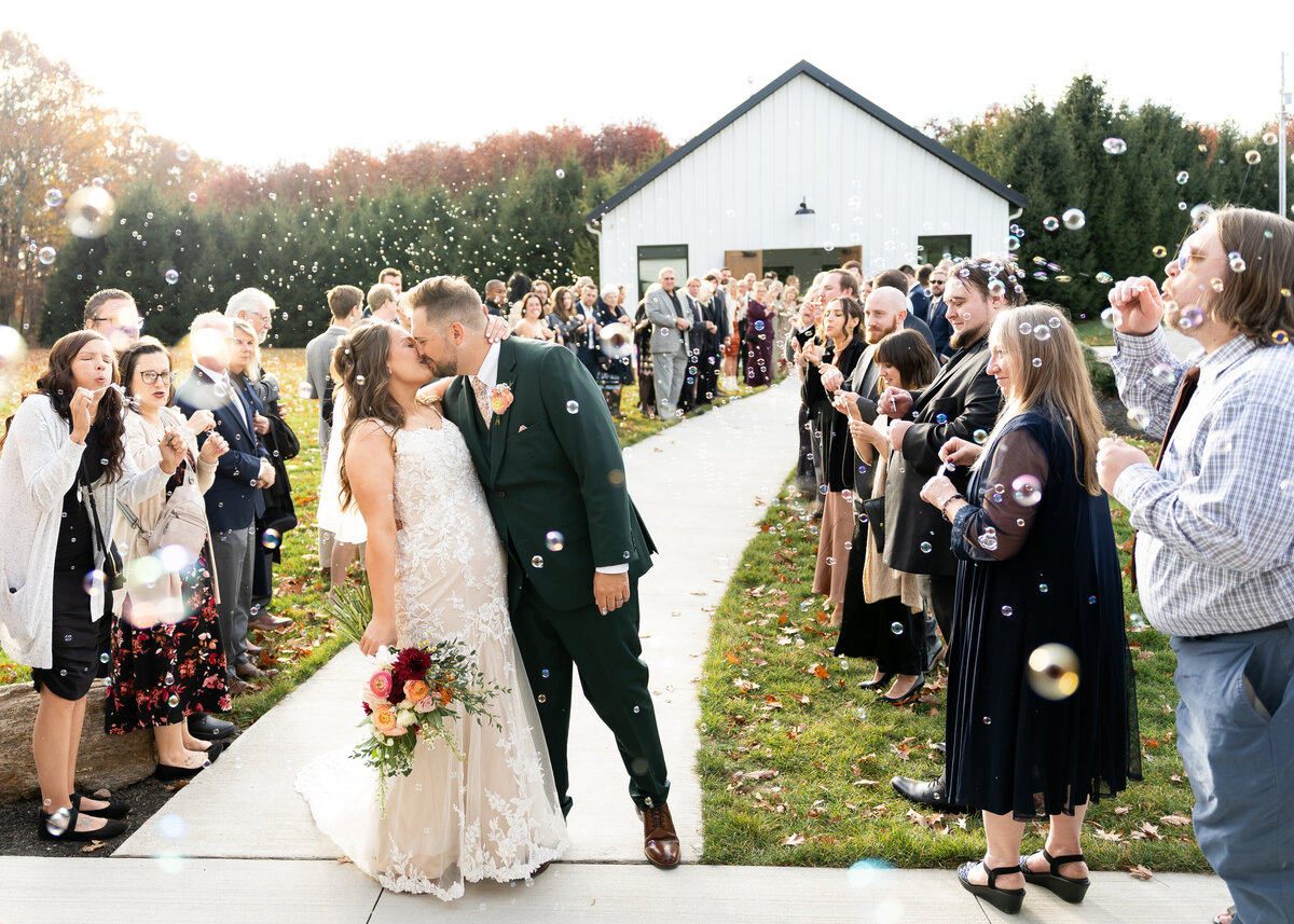 bubble exit after ceremony celebrating couple at The Wellspring