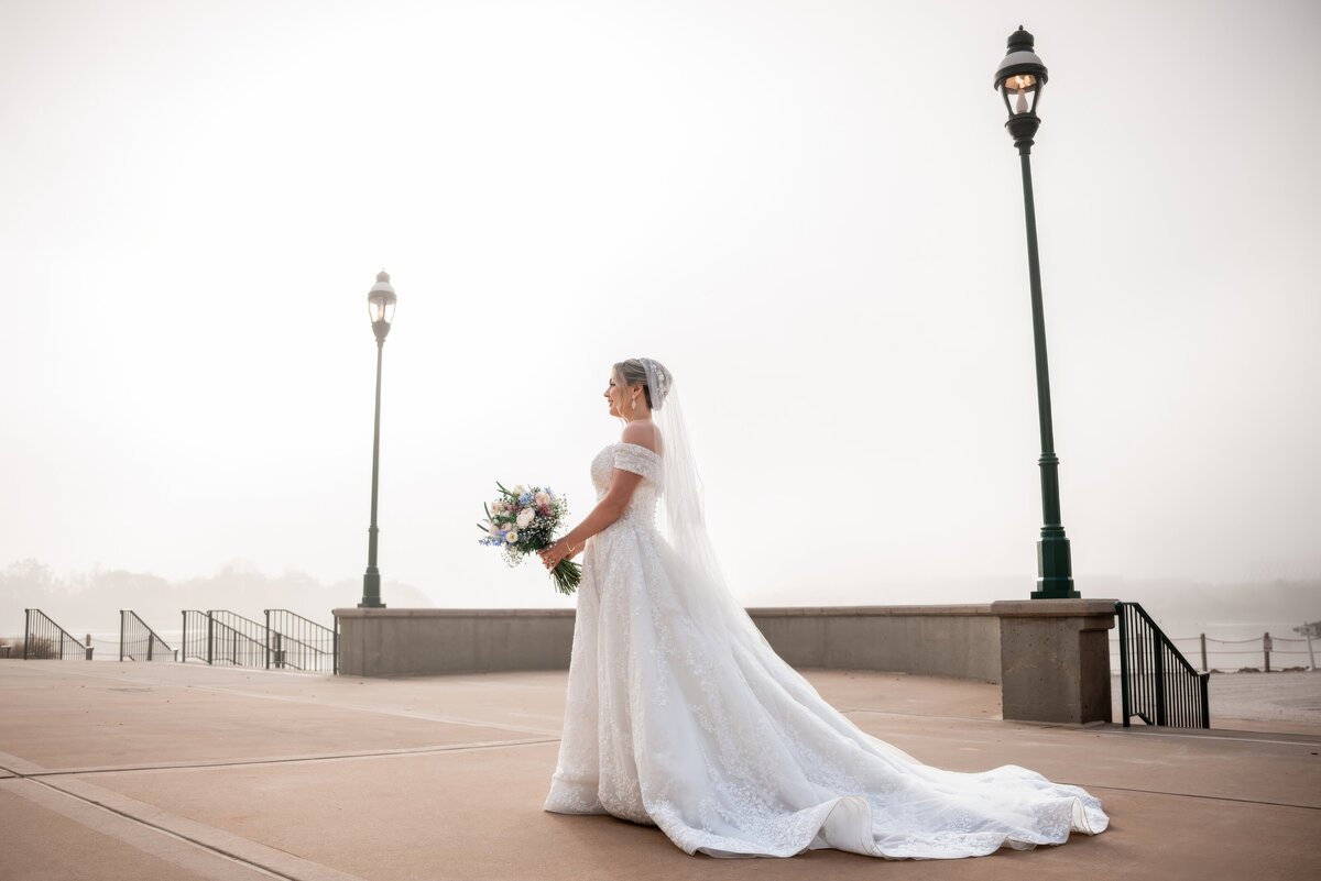 bride walking in a foggy morning at disney