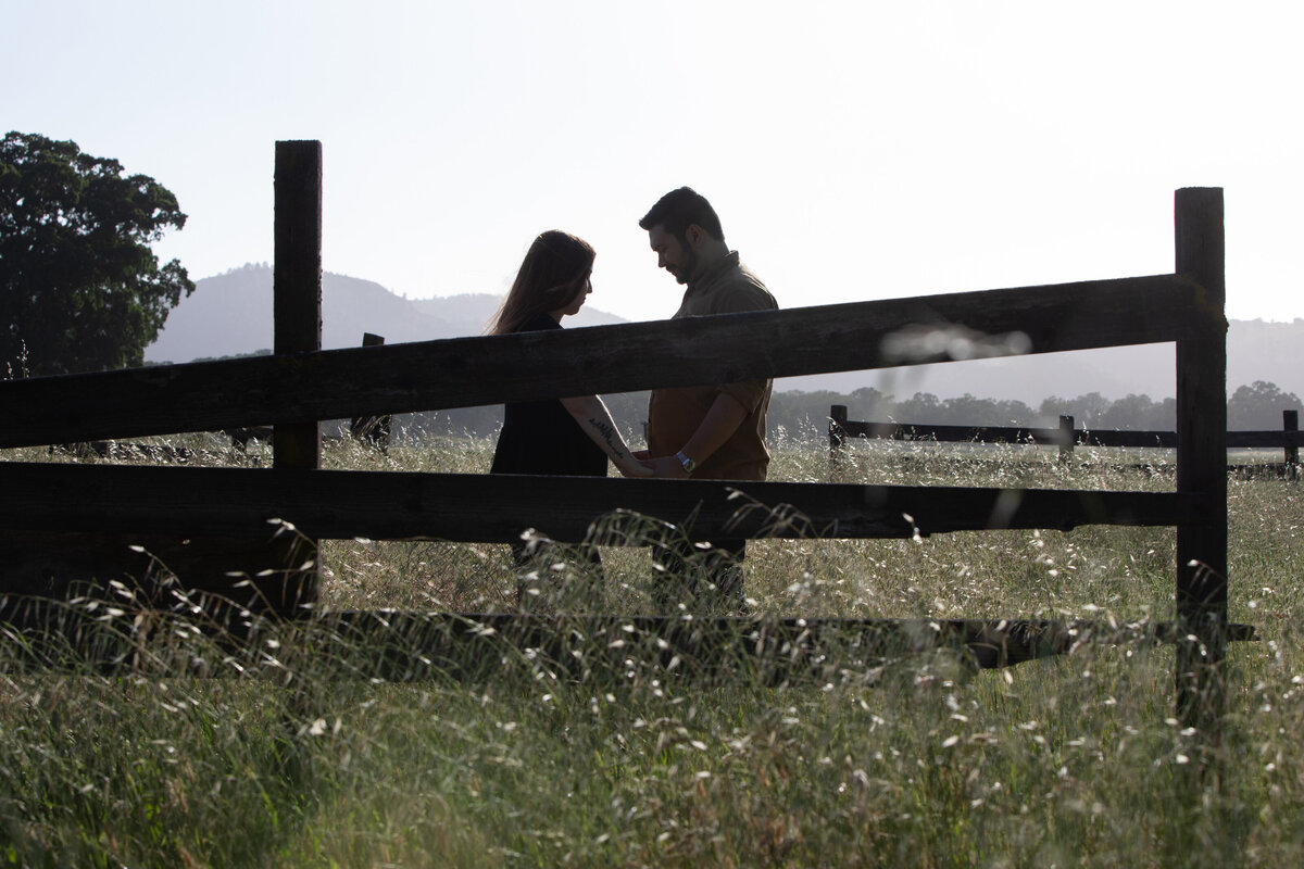 silouette by fence engagement shoot