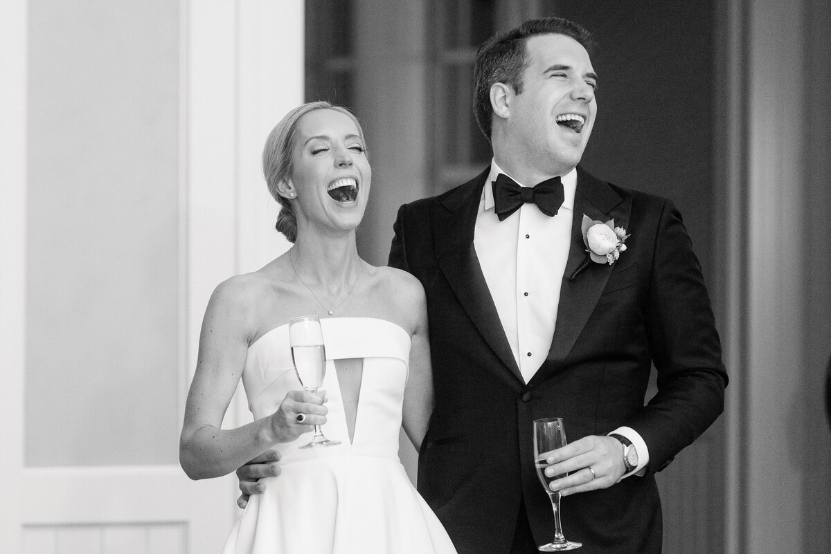 bride and groom react to funny toast at their wedding