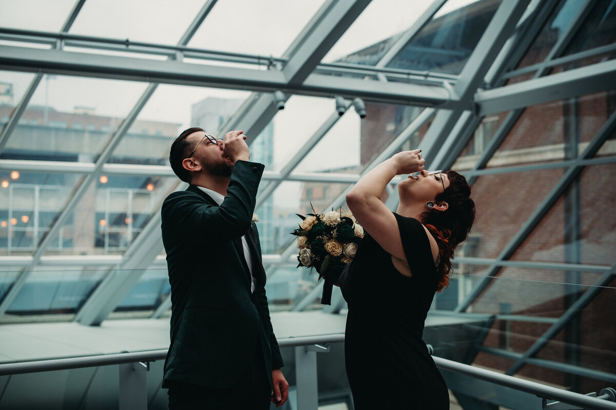 Bride and Groom take a shot of Fireball, a fun gift from the bride at the first look reveal.