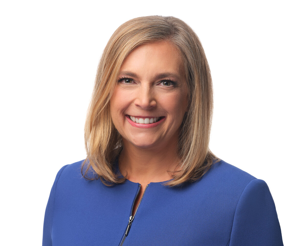 A woman with short hair smiling