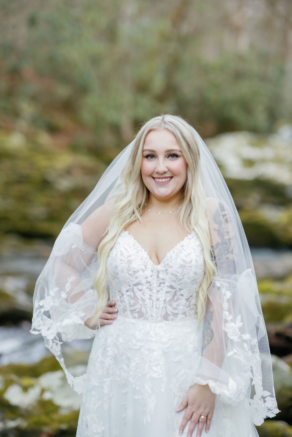 bridal photo with bride posing outside of Ely's Mill in the woods as she elopes to Gatlinburg 