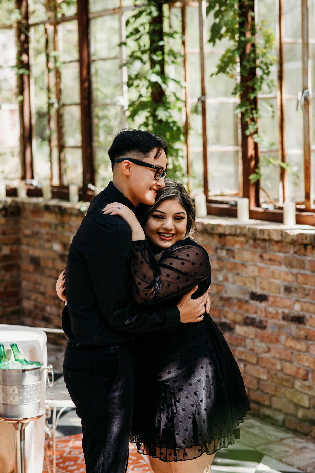 Proposal planning in Austin  couple embracing woman smiling at camera