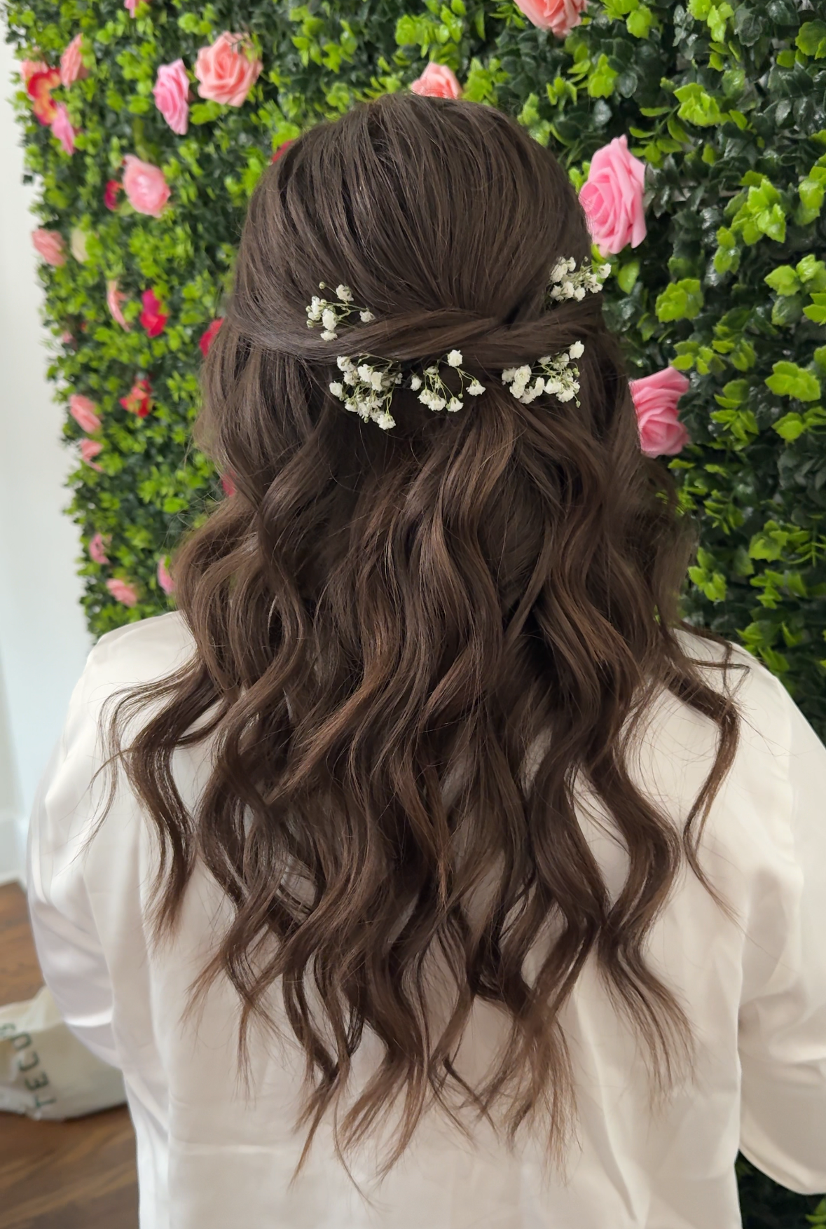 half up half down bridal hair style with babies breath dark hair