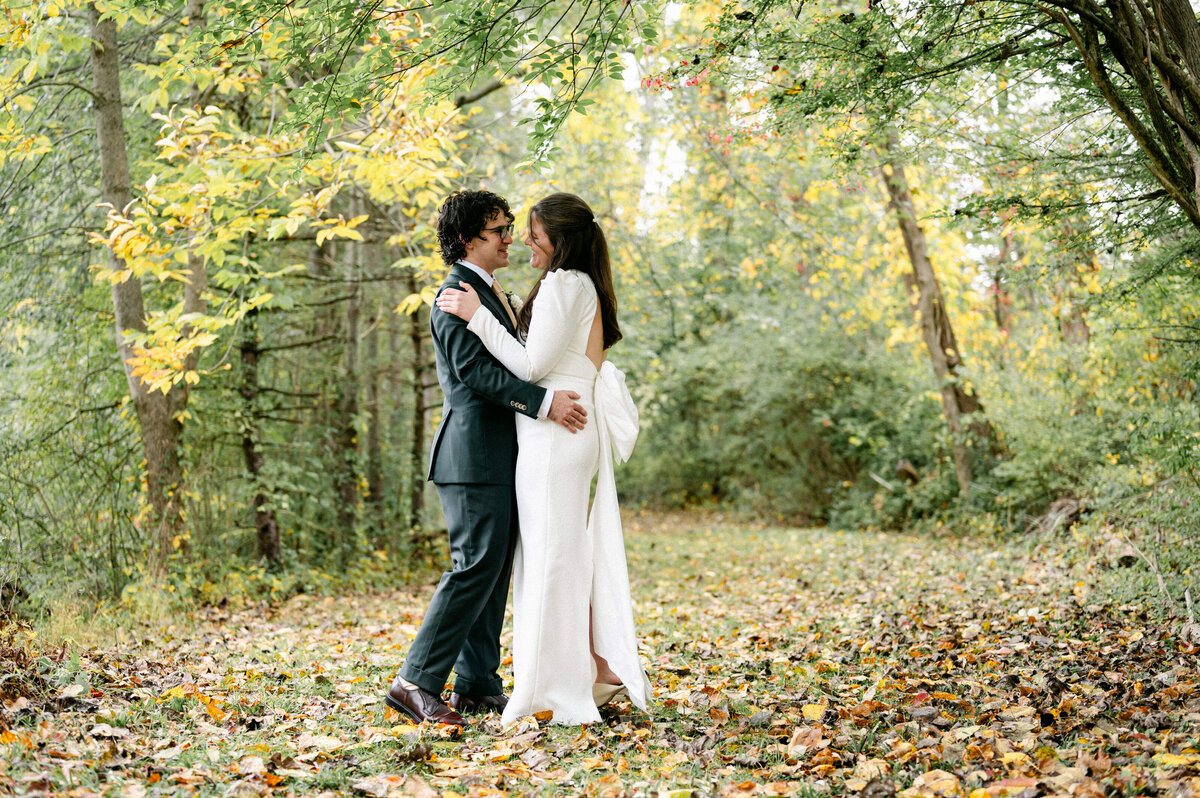 Bride and groom holding each other while standing