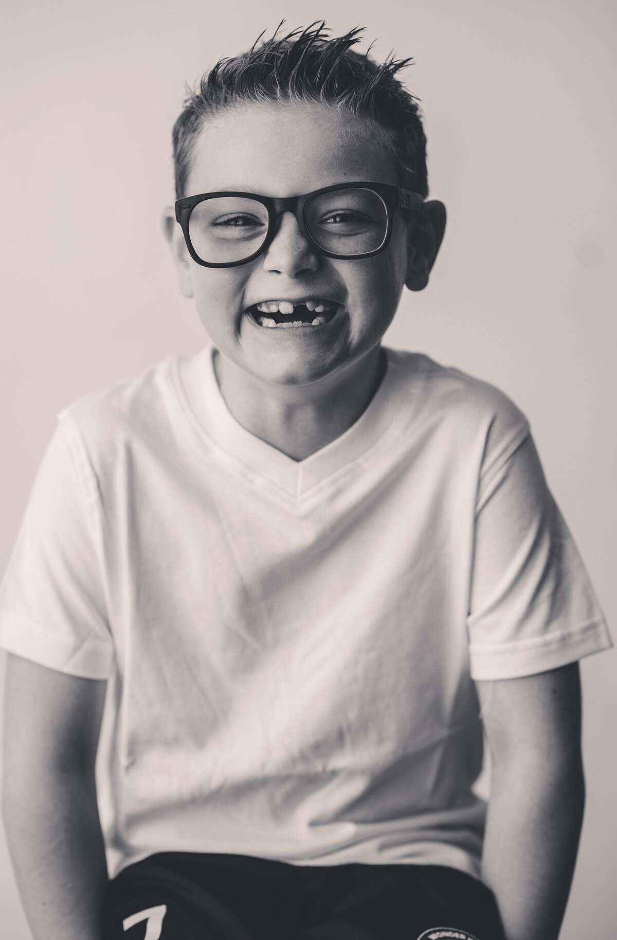 Young boy smiles at the camera during Personality Portrait Photoshoot in Charleston, SC. 