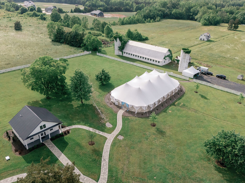 Aerial view of the sailcloth tent, groom's cottage and fields