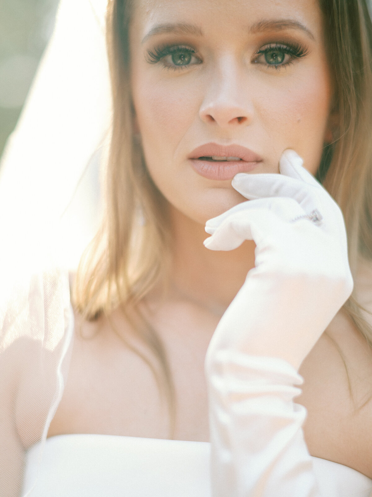 Editorial bride with gloves posing for camera