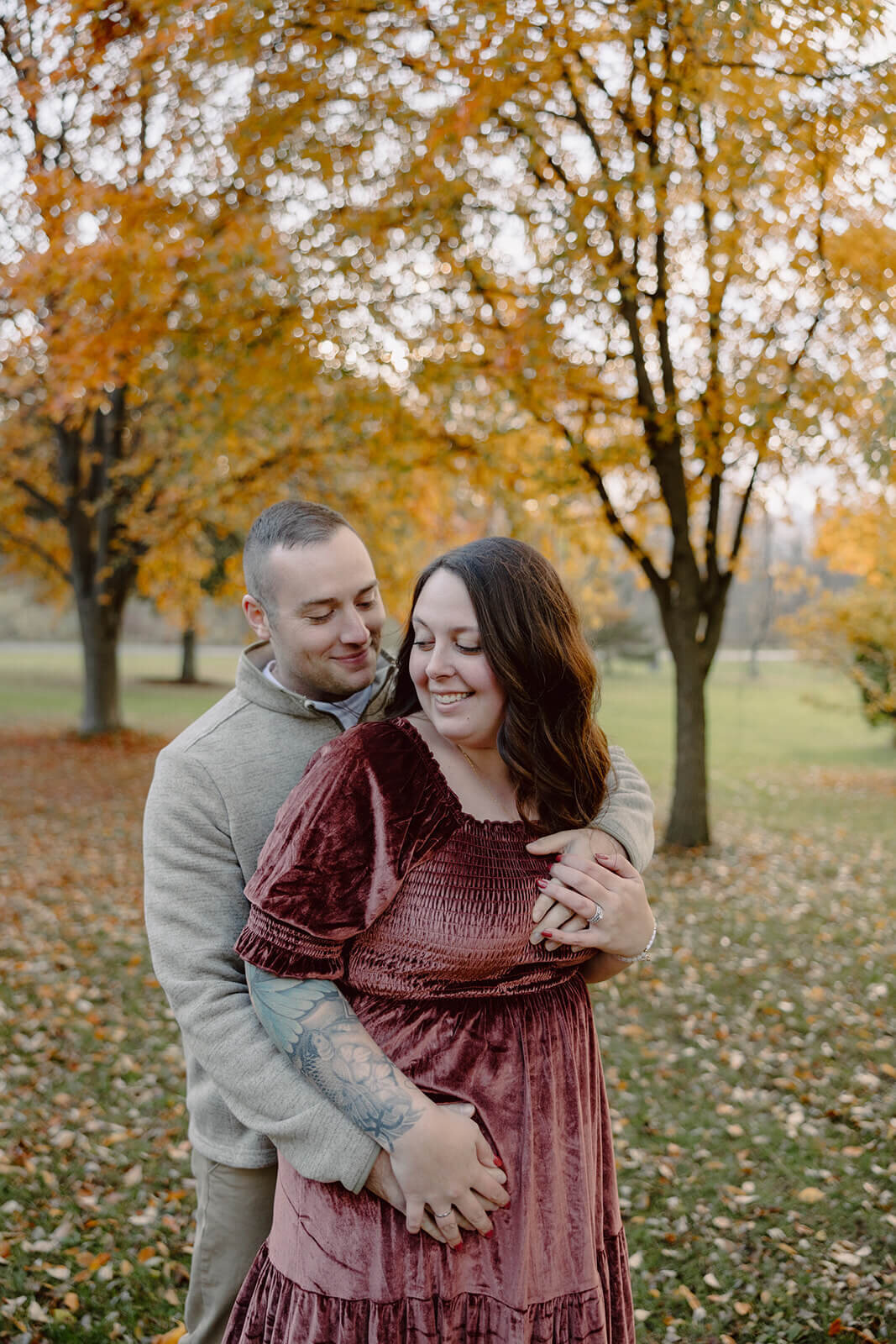 Man with arms around woman at  Finger Lakes Maternity session