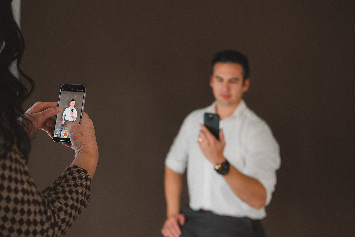A person takes a photo with their phone