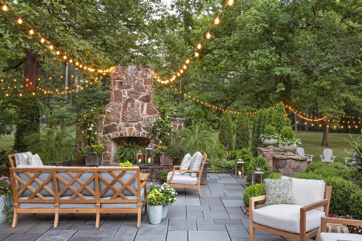 backyard-fireplace-patio-lanterns-string-lights-garden-retreat