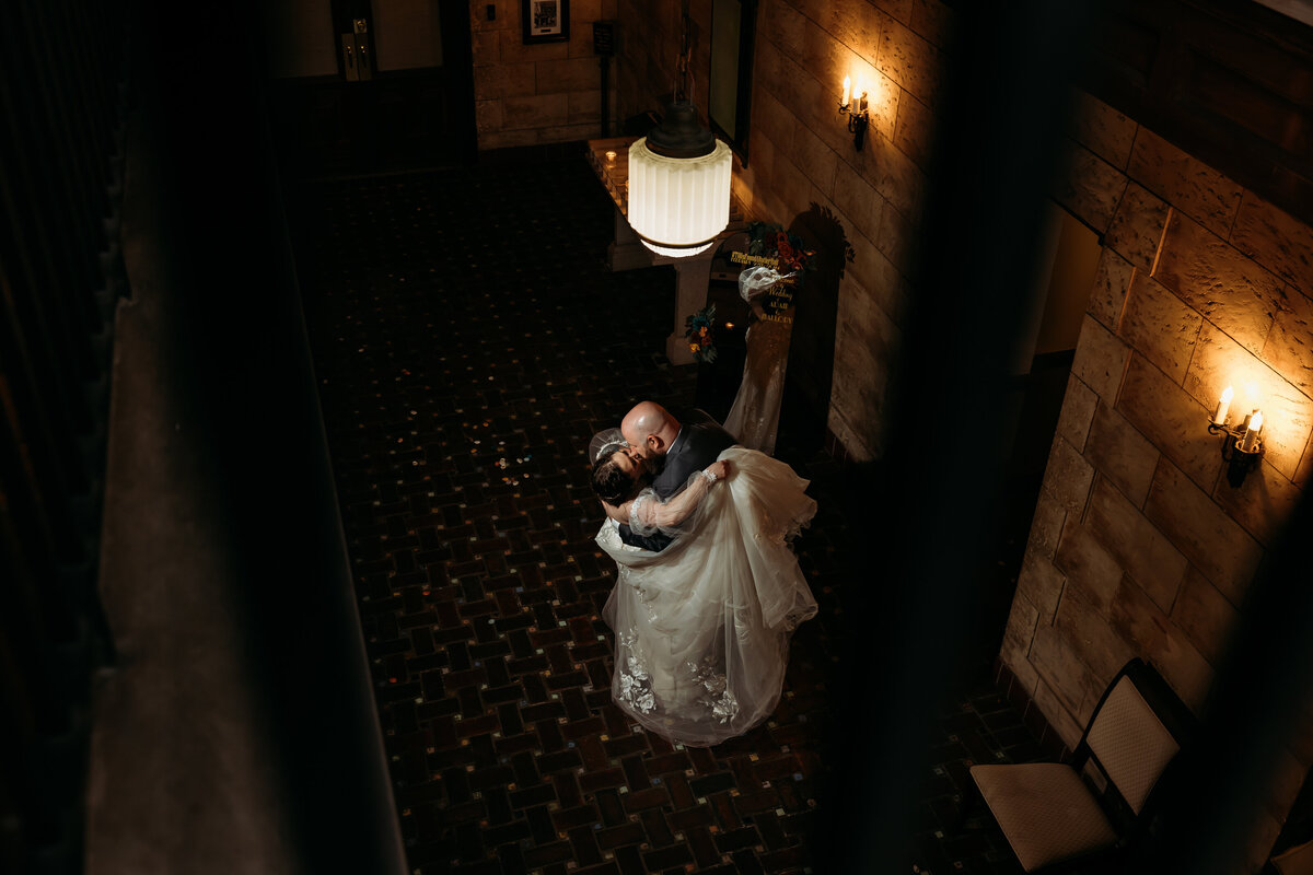 Bride and groom dance and laugh during their reception inside Treasury on the Plaza, a popular wedding venue in St. Augustine, Florida.