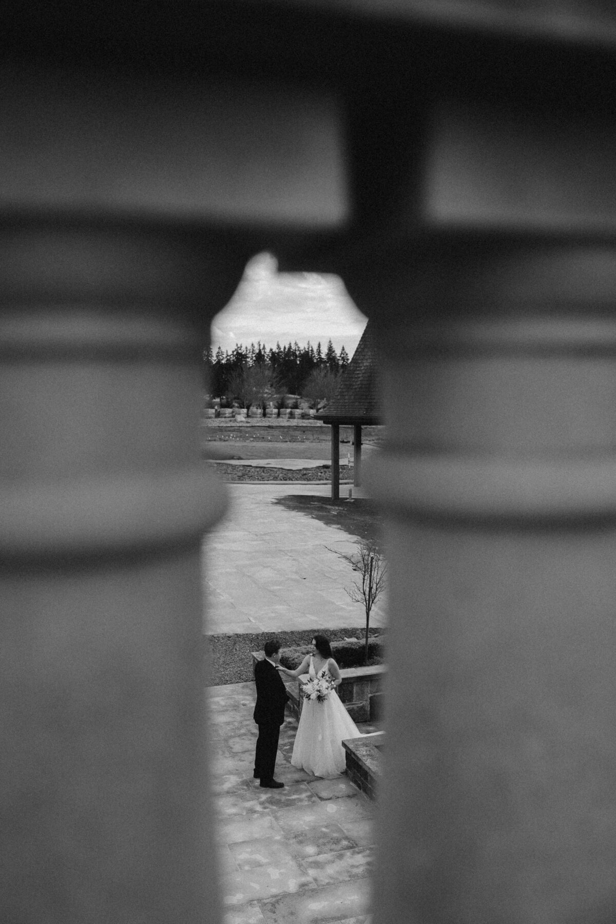 Intimate Moment Between Bride and Groom Framed by Architecture | Fine-Art Oregon Wedding Photography